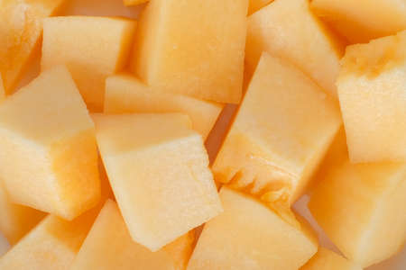 closeup of sliced orange cantaloupe melon for food backgroundの写真素材