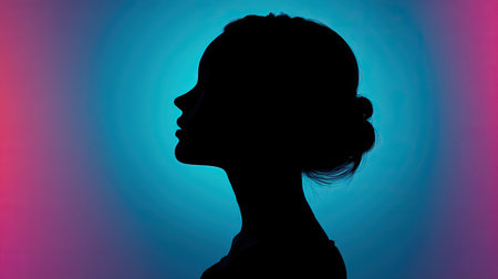 A striking silhouette of a woman's profile is set against a colorful gradient background, combining blue and pink hues. This image evokes feelings of serenity and elegance, perfect for artistic projects.の素材