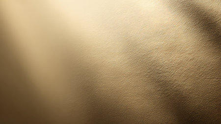 This image features a soft golden texture with gentle light play, ideal for crafting sophisticated backgrounds and design elements in various projects.の素材