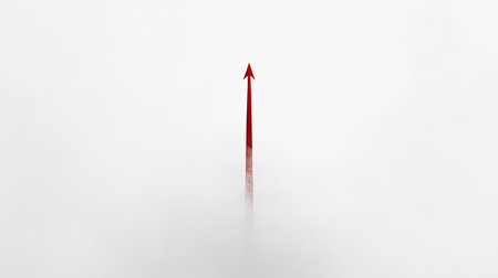 A striking minimalist image featuring a red arrow pointing upwards through a soft white mist, symbolizing direction, growth, and inspiration in a tranquil setting.の素材