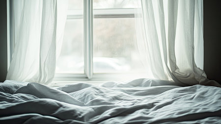 A bright window with sheer curtains elegantly frames a cozy bed, creating a soothing, tranquil atmosphere perfect for morning relaxation and comfort.の素材