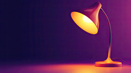 This image showcases a modern table lamp featuring a bright orange shade, casting a warm glow, perfect for enhancing interior decor in diverse settings.の素材