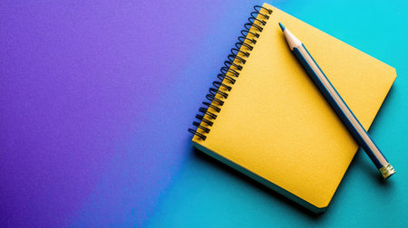 A vibrant yellow notebook lies next to a pencil on a striking gradient background, perfect for capturing creative ideas, inspirations, and notes.の素材