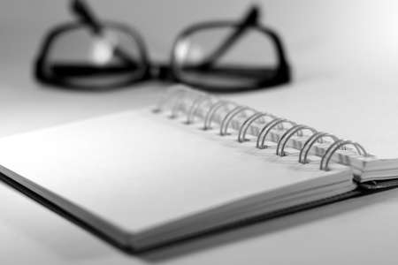 Notebook with eyes glassesの写真素材