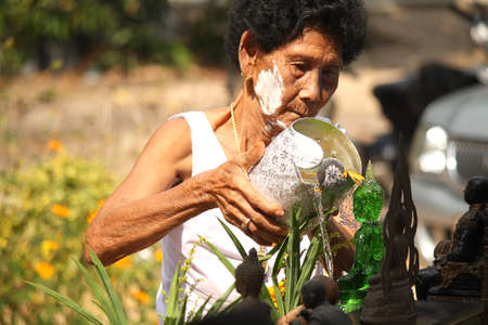 Elderly Bathing Buddha in songkran thailand festival のeditorial素材