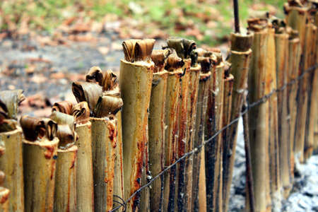 glutinous rice roasted in bamboo joints , Burn cookingの写真素材
