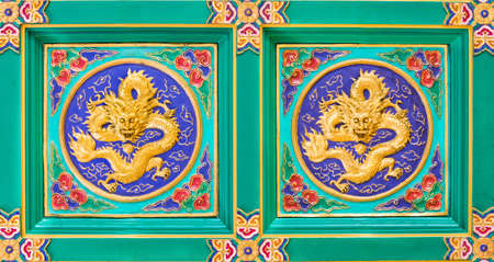 Golden Dragon on the  Temple Wall As Thailandの写真素材