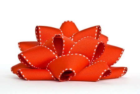 Red grosgrain bow on white backgroundの写真素材