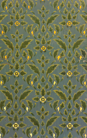 Ancient Thai floral pattern painting on temple wall, Thailandの写真素材