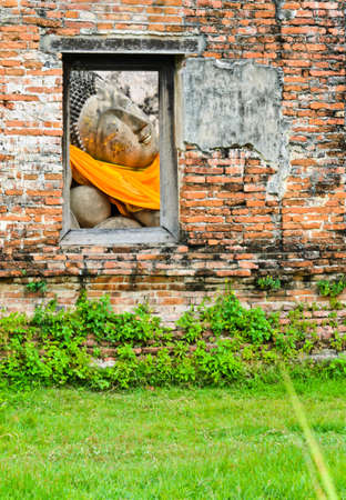 Reclining buddha in window frameの写真素材