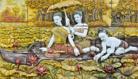 Thai culture stone carving on temple wall