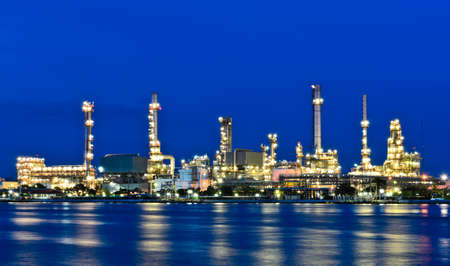 Oil refinery plant illuminated at duskの写真素材