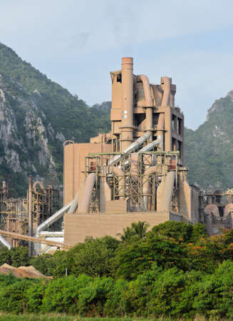Cement plant with limestone mountain の写真素材