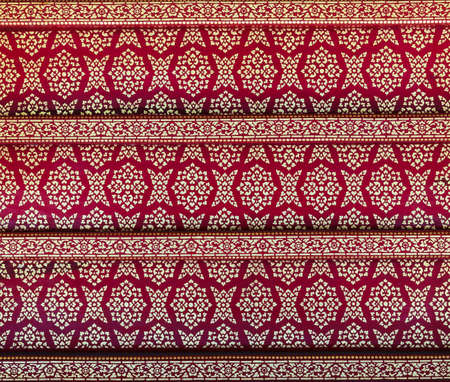 Ancient Thai floral painting on temple ceilingの写真素材