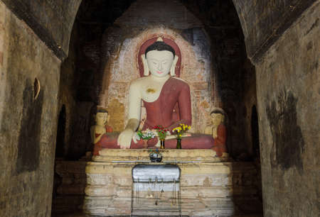 Ancient seated buddha statue in Bagan temple, Myanmar のeditorial素材