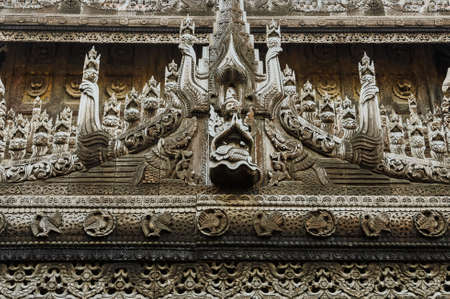 Wooden carving detail at Shwenandaw Kyaung Temple in Mandalay, Myanmarの写真素材