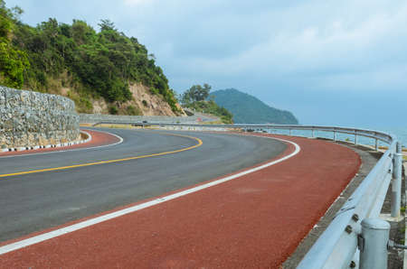 Asphalt road along a tropical sea coastlineの写真素材