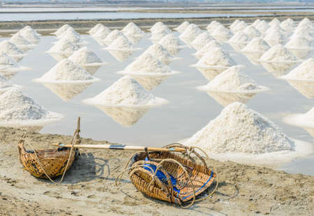 Heap of sea salt in evaporation pond, Thailandの写真素材