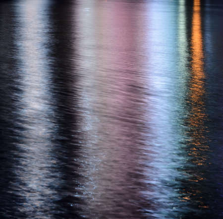 Colorful lights reflection on the waterの写真素材