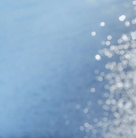 Bokeh lights shining on sea backgroundの写真素材