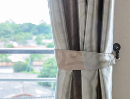 Glass window with curtainの写真素材