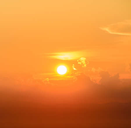 Golden sunset sky with cloud over the mountain range