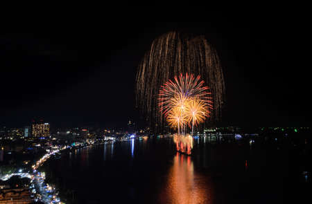 Aerial view of Pattaya city with firework at beach, Thailand