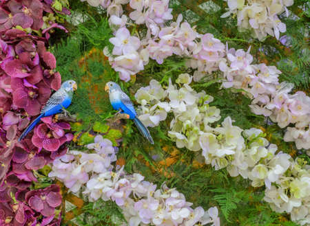 Decorated flower wall with bird doll