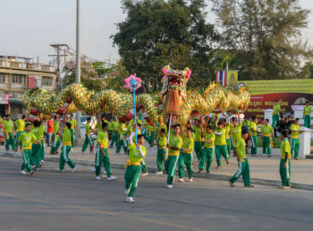 NAKHONSAWAN,THAILAND - FEBRUARY 13: Chinese New Year parade on February 13, 2013 in Nakhonsawan, Thailand. Chinese dragon dance performance for Chinese New Year Celebrations.のeditorial素材