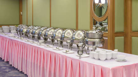 Catering buffet food indoor with heated trays ready for service