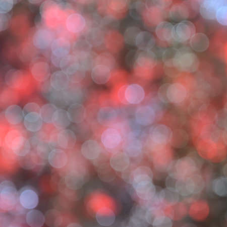 Defocused abstract red and yellow Christmas bokeh backgroundの写真素材