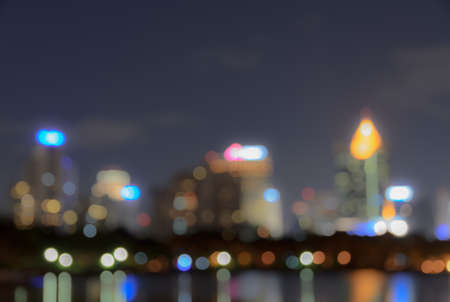Bangkok skyline at night with reflection on water - Blurred bokeh backgroundの写真素材