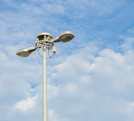 Street lighting pole in cloud sky