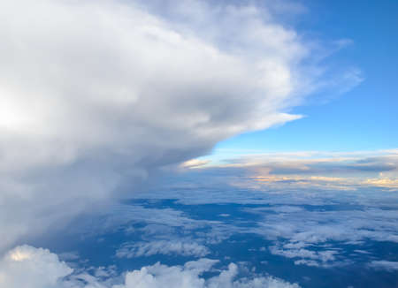 Blue sky with clouds background. View from airplaneの写真素材