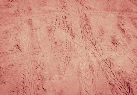 Tyre tracks texture on sand beach background in vintage style colorの写真素材
