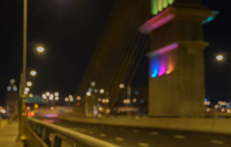 Blurred image of cable bridge at night with bokehの写真素材