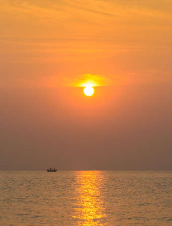 Beautiful seascape sunrise with boatの写真素材