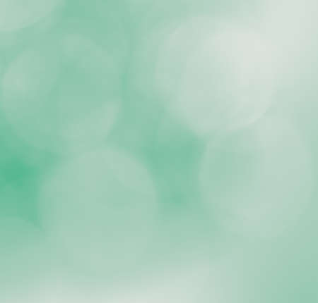 De-focused lights bokeh abstract on green backgroundの写真素材