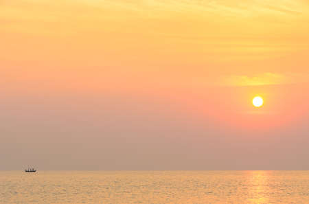 Beautiful seascape sunrise with boatの写真素材