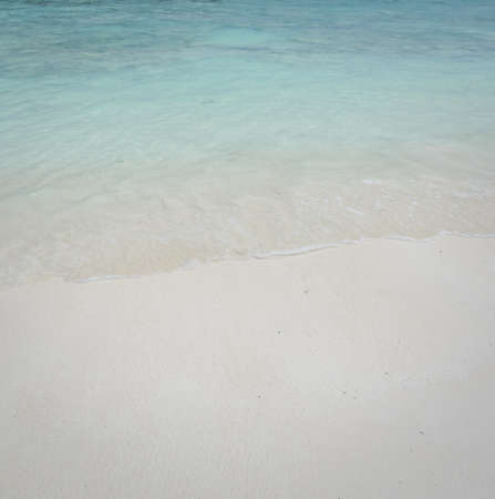 Beautiful white sand beach and crystal clear water for nature backgroundの写真素材