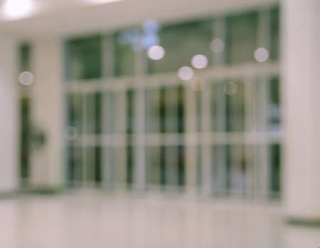 Defocused office, hospital or shopping mall building door backgroundの写真素材