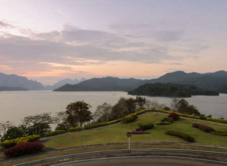Stunning view of Limestone mountains and lake at twilight in Surat Thani, Thailandの写真素材