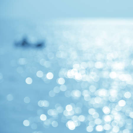Abstract nature sea background - blurred kayaking on the sea at sunsetの写真素材