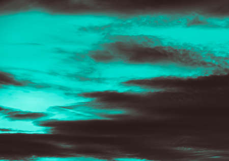 Dramatic sky with storm cloud background in vintage filter effectの写真素材