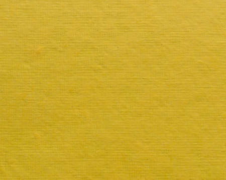 Yellow handmade paper pattern texture backgroundの写真素材