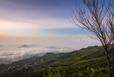 Panoramic view of mountain landscape with curve road at sunrise over sea of fog in Phetchabun, Thailandの写真素材