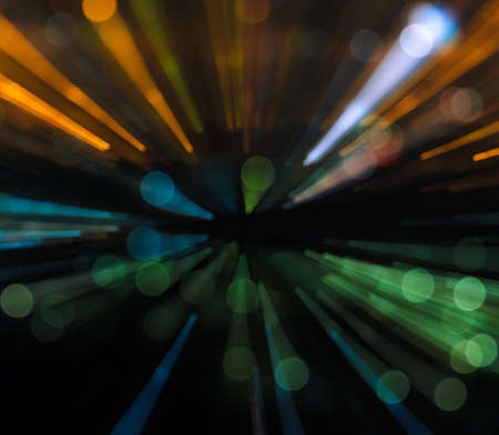 Blurred night bokeh with lights trail using zoom techniqueの写真素材