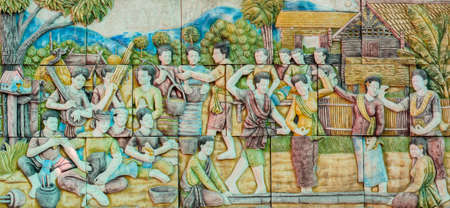 Thai stucco art of traditional Thai bamboo clapping folk dance, Thailandの写真素材