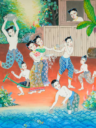 Native Thai mural painting of Songkran festival in the past on temple wall in Loei, Thailand.の写真素材