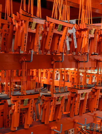 KYOTO, JAPAN -NOVEMBER 22, 2016: Torii (Gate in Shinto Shrines) shaped Ema, which is a smal wooden plaque for the prayers to write their wishes at Fushimi Inari Taisha Shrine in Kyoto Japanのeditorial素材
